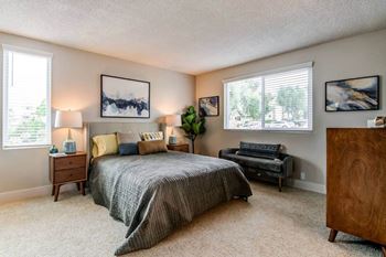 a bedroom with a bed and a couch and a window at Veranda La Mesa, La Mesa, California